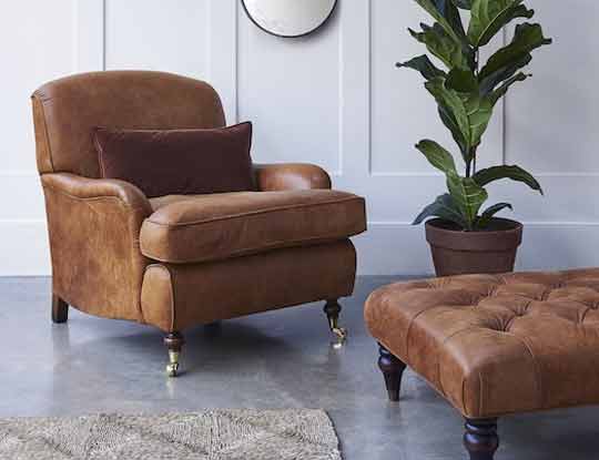 rust leather armchair and footstool