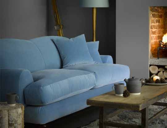 large plain sofa in blue velvet fabric